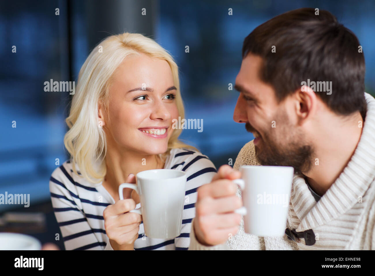 happy couple meeting and drinking tea or coffee Stock Photo