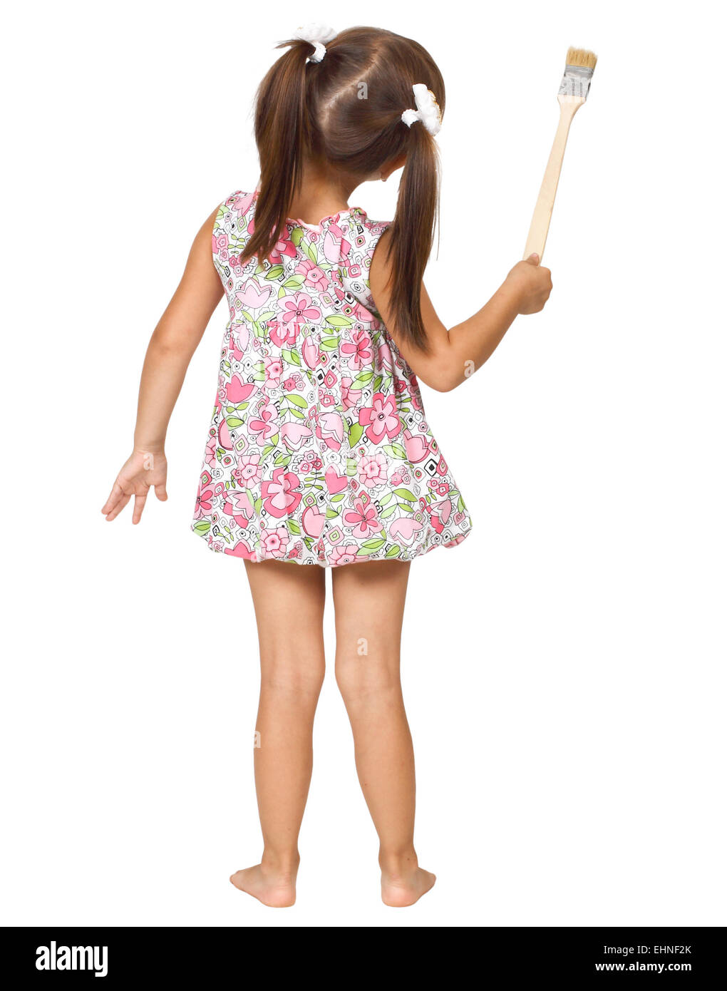 little girl with paintbrush, back view Stock Photo