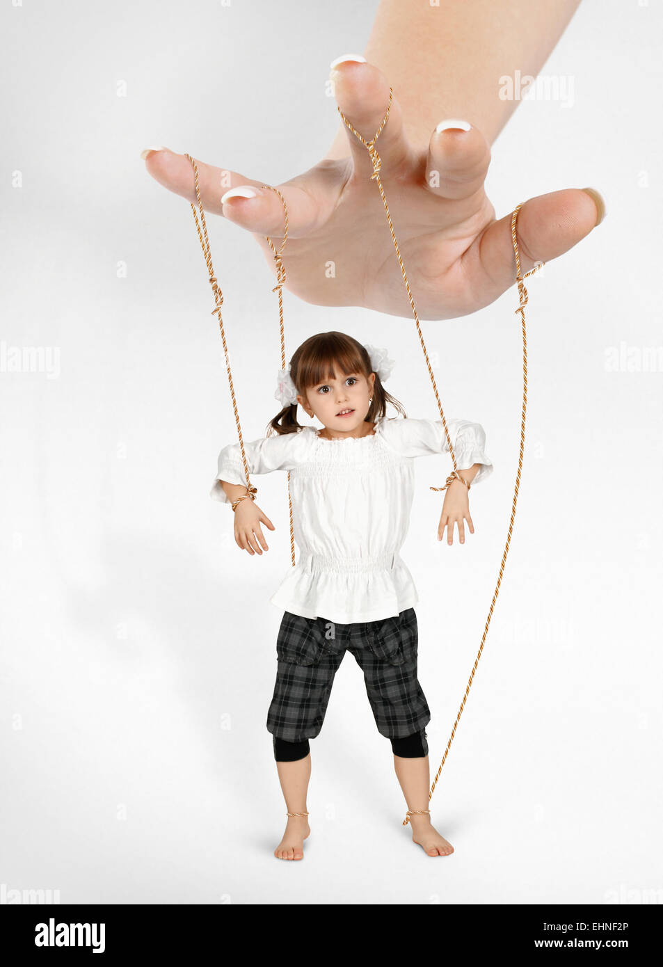 child girl - puppet , dependence concept Stock Photo