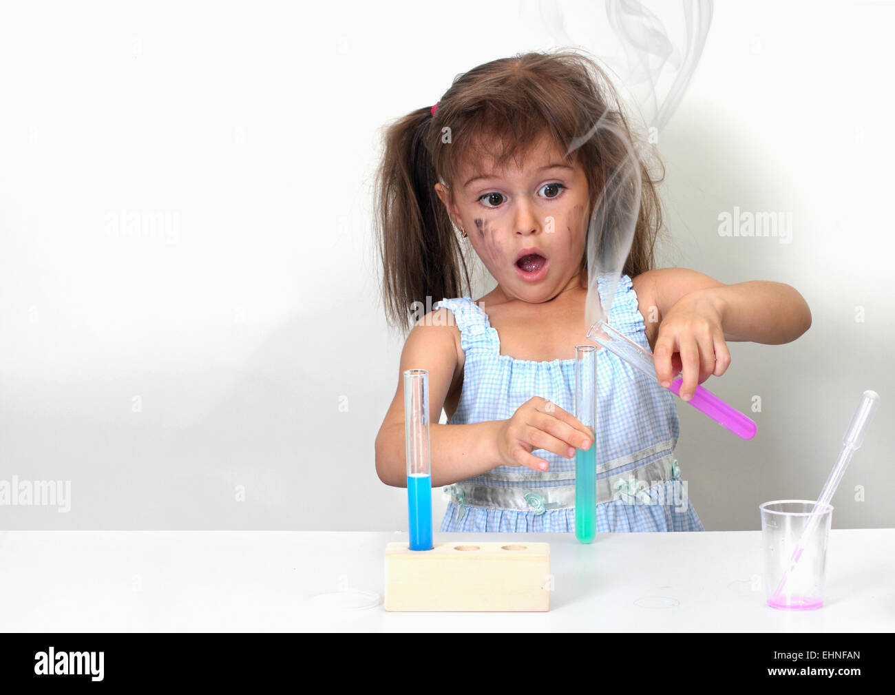 dirty child making unsuccessful chemical experiment Stock Photo