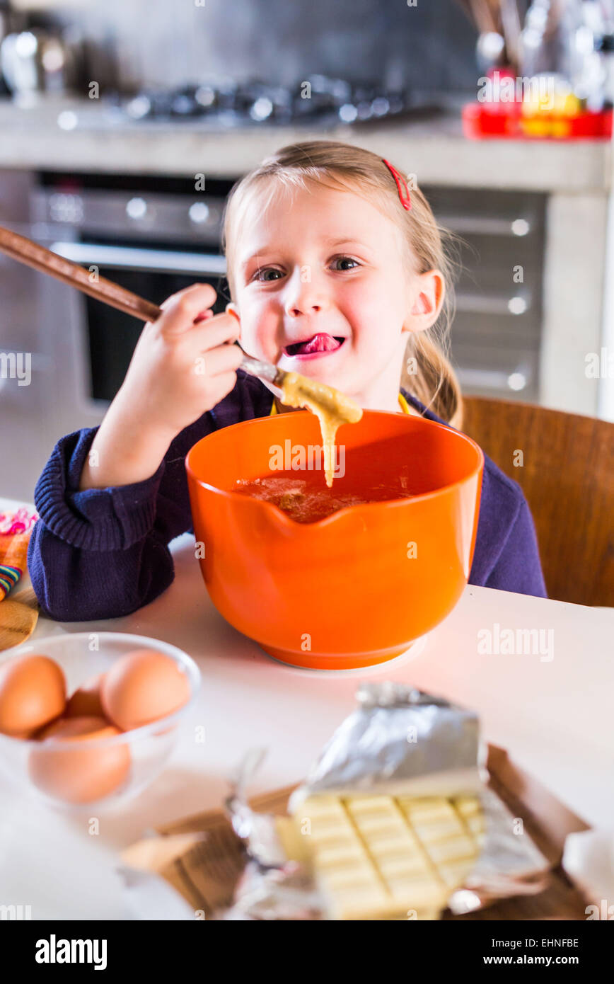 5 year-old girl learning cooking. Stock Photo
