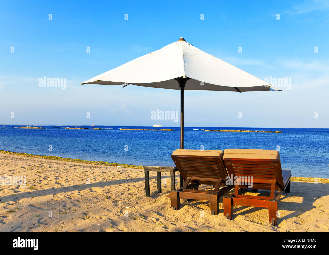 Umbrella and chaise lounges on a beach Stock Photo Alamy