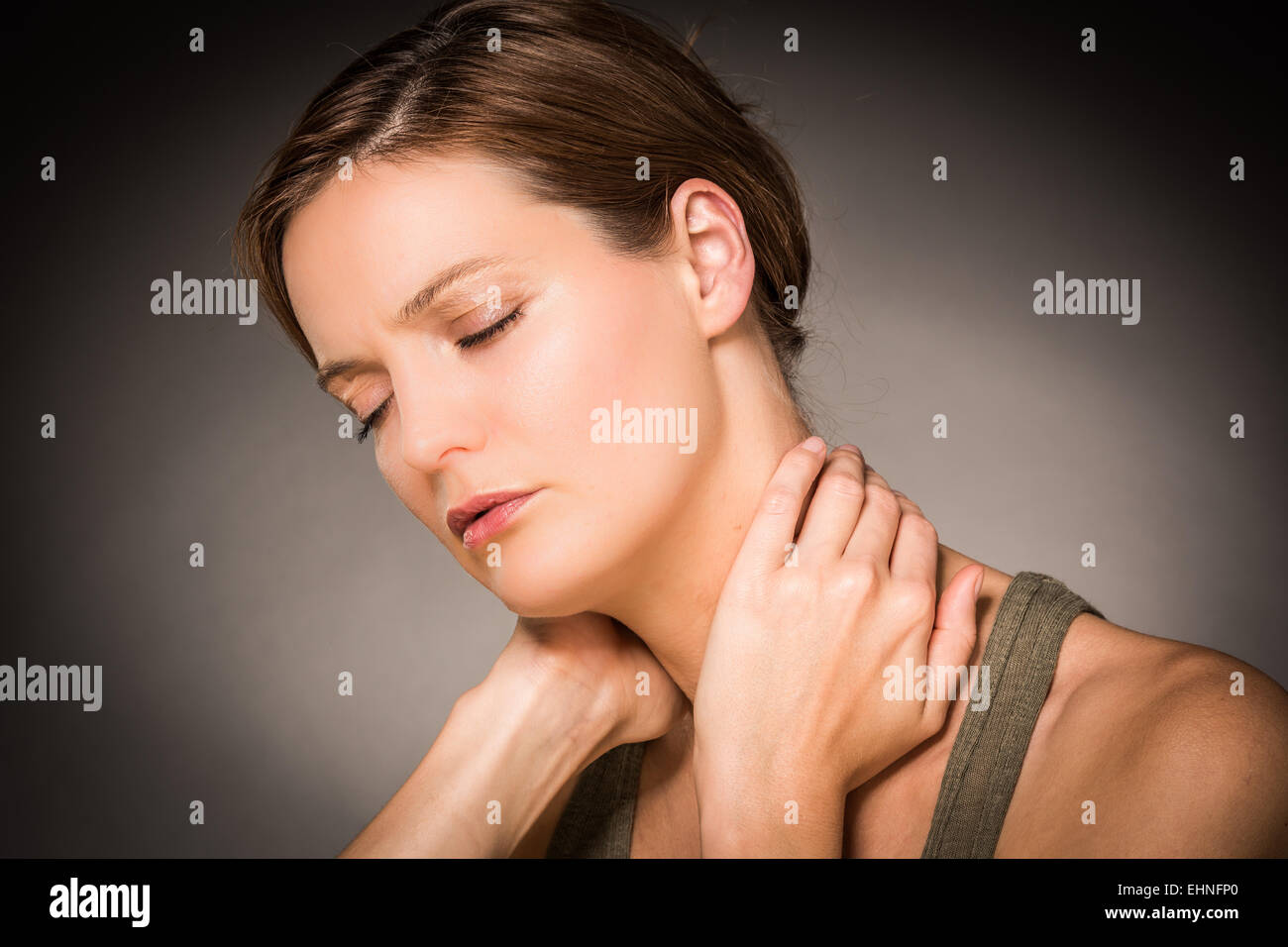 Woman suffering from neck pain. Stock Photo
