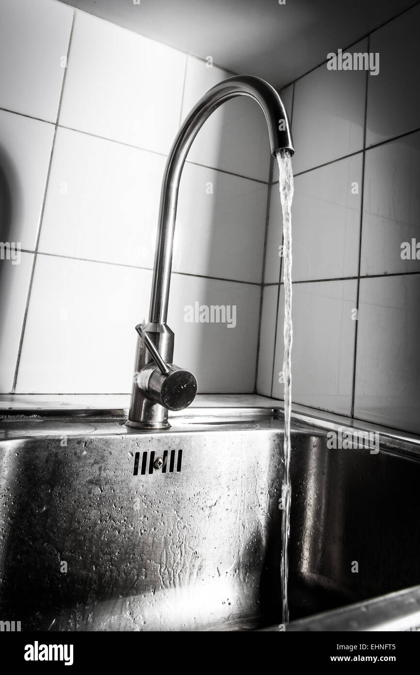 Water running from a tap. Stock Photo