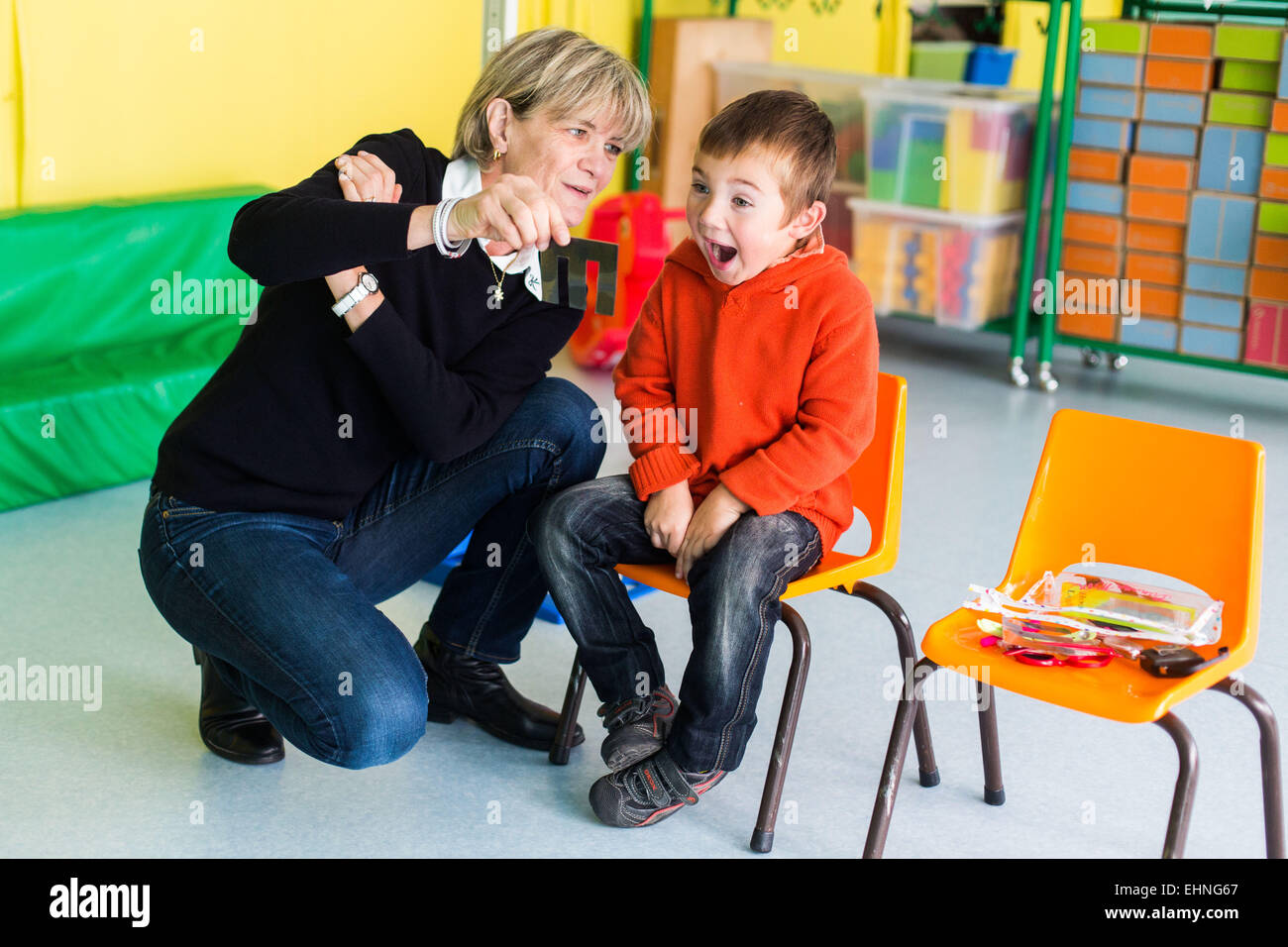 Medical check-up performed by a pediatric nurse of MCW in infant school, Charente, France. Stock Photo