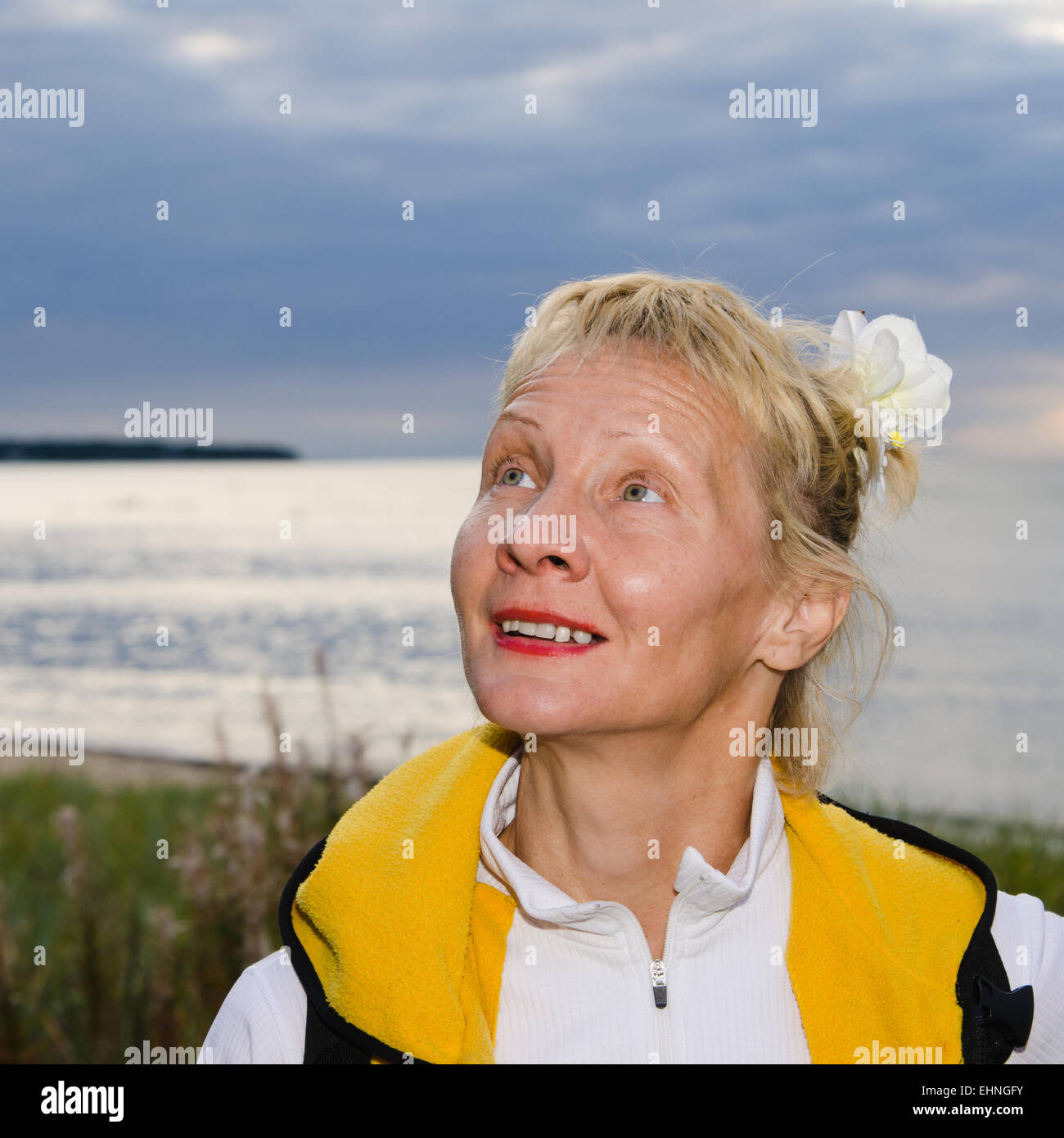 Mature woman enjoying herself on the beach Stock Photo - Alamy