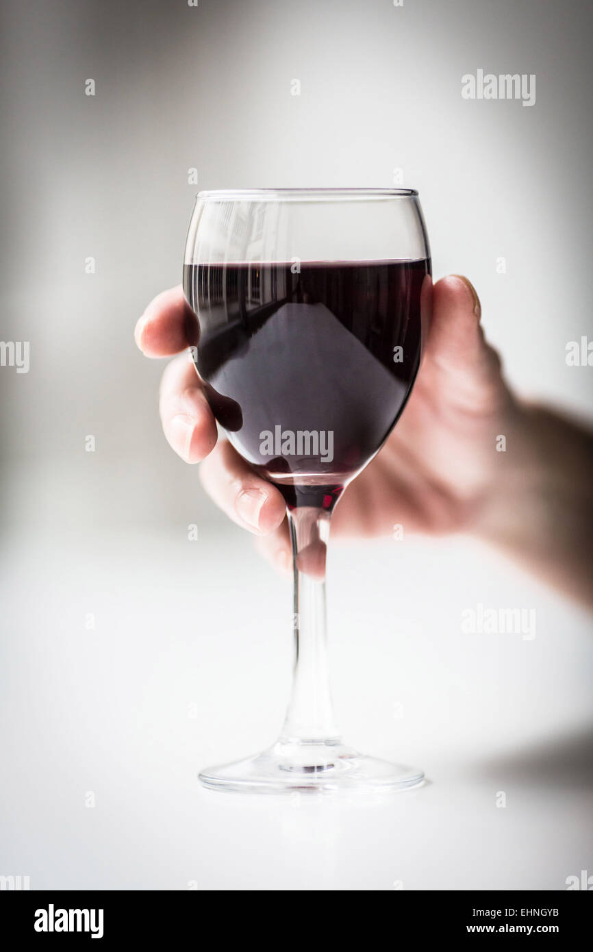 Woman holding glass of wine hi-res stock photography and images - Alamy