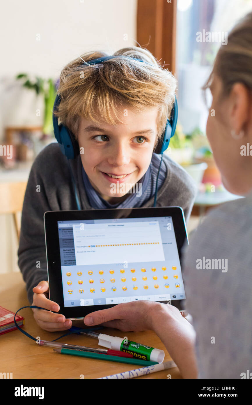 8 year old boy using tablet computer. Stock Photo