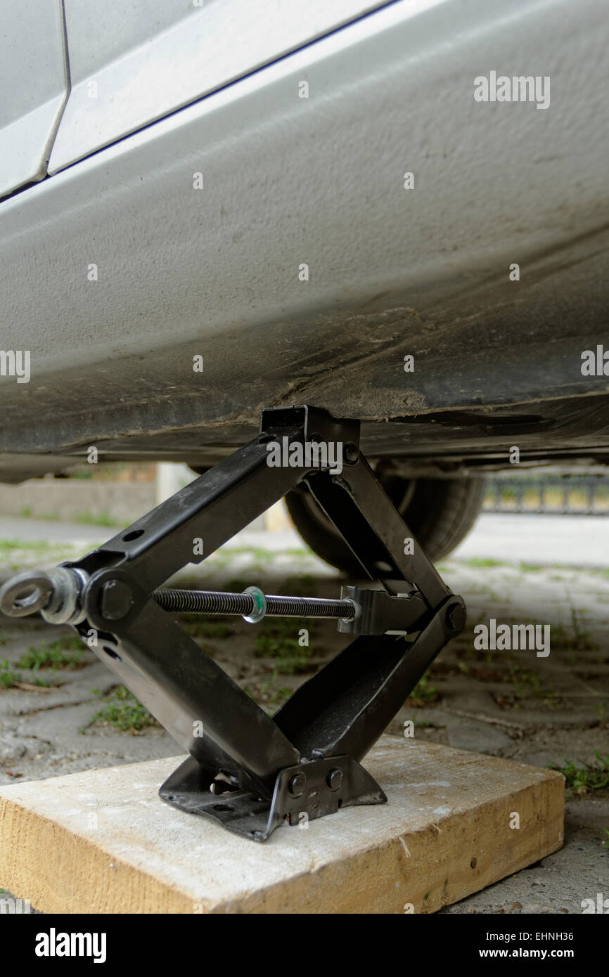 Car lifting for service with handlifter Stock Photo Alamy