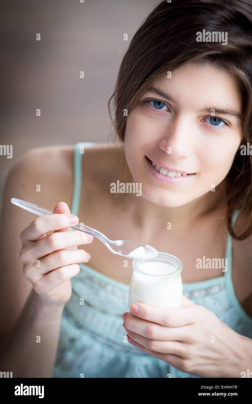 Woman eating yogourt. Stock Photo