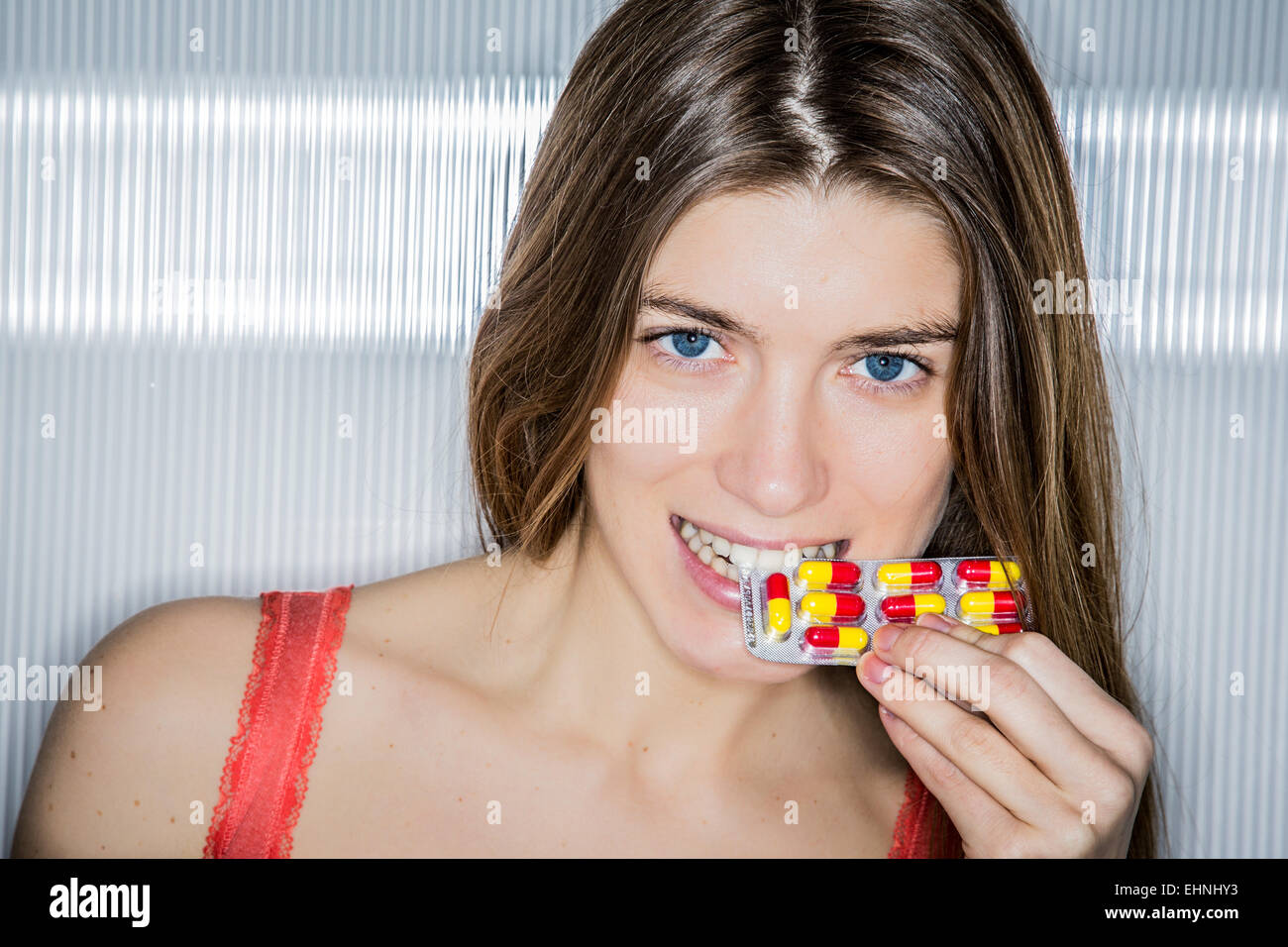 Woman taking tablet. Stock Photo