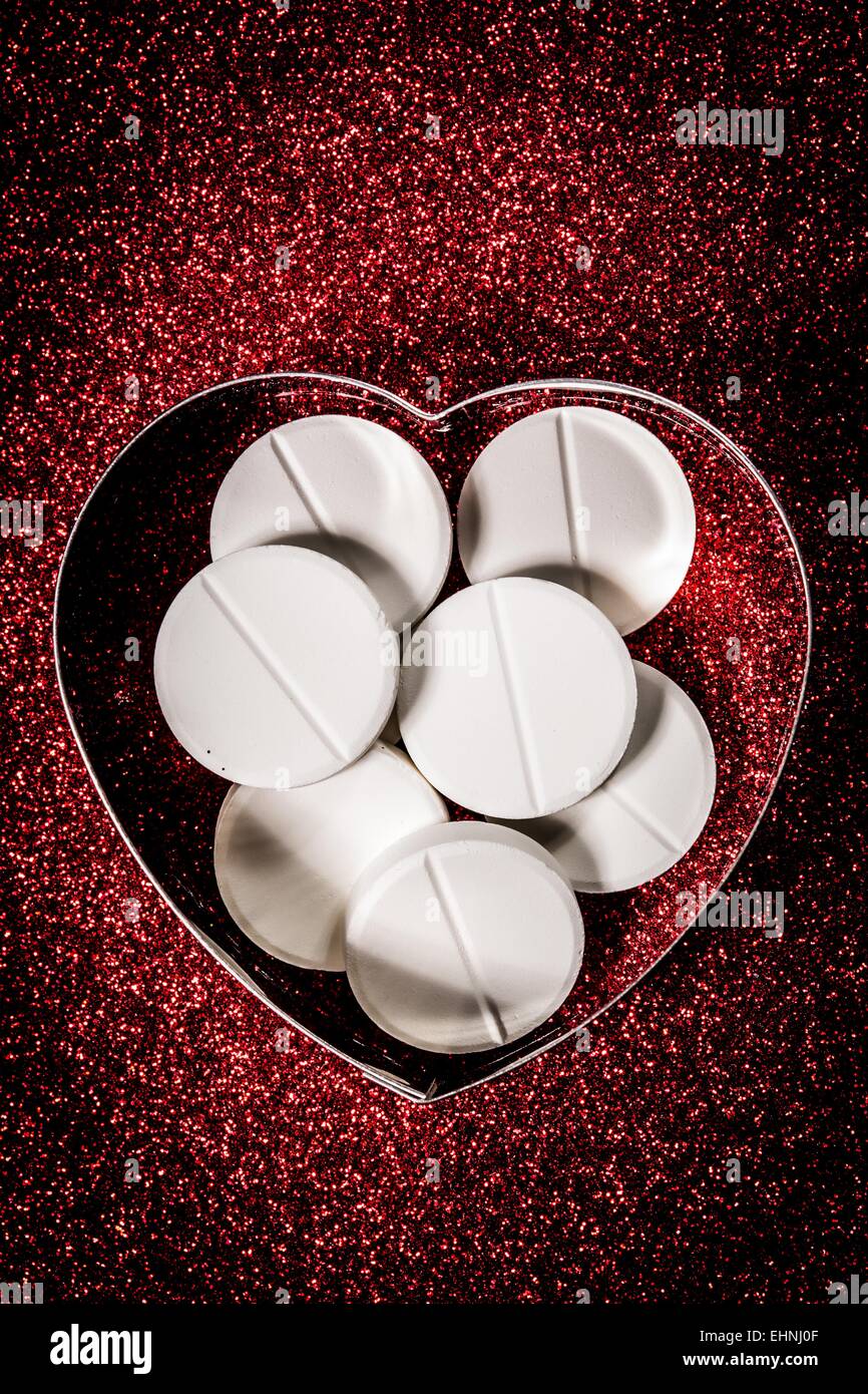 Conceptual image about daily aspirin in prevention of myocardial infarction. Stock Photo