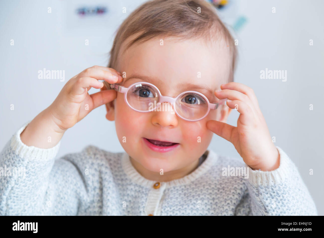 18 month-old baby boy wearing glasses. Stock Photo