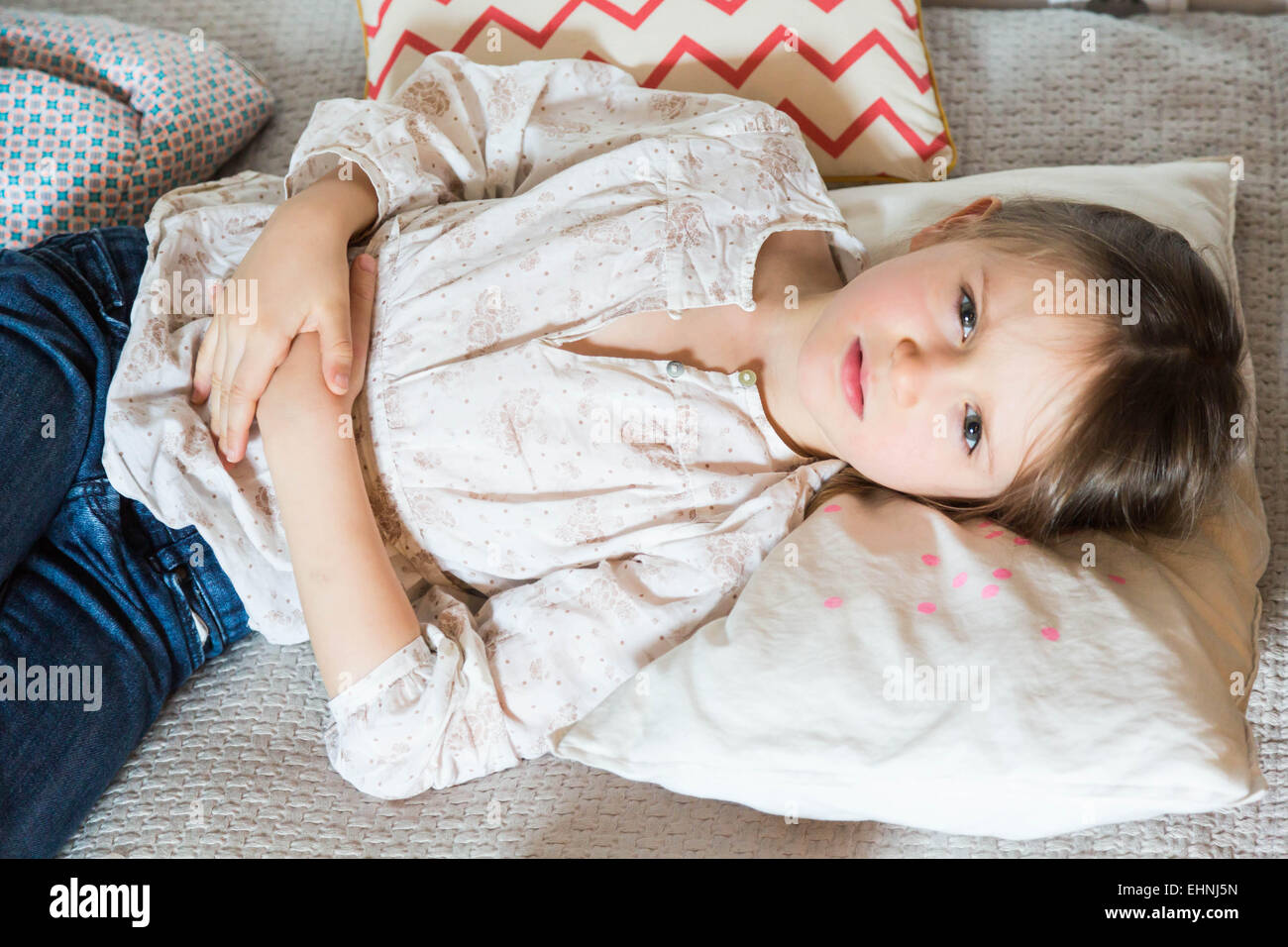 5 year-old child suffering from bellyache. Stock Photo