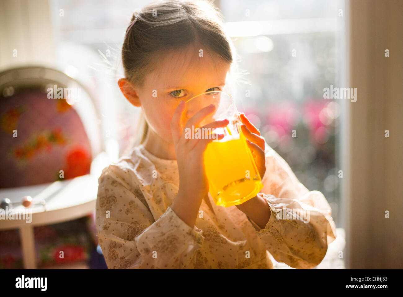 5 year-old girl drinking soft drink. Stock Photo