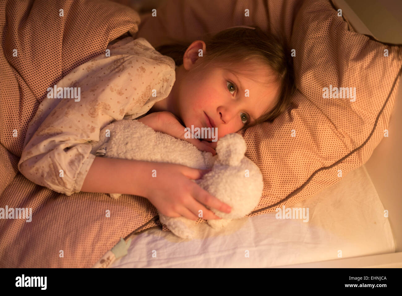 5-year-old-girl-lying-down-on-bed-stock-photo-alamy