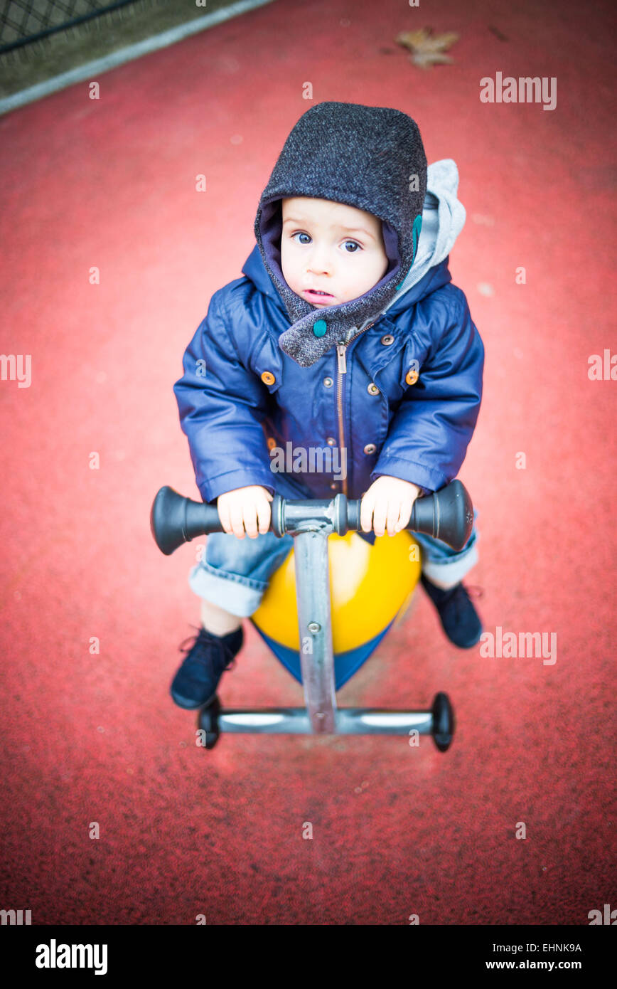 18 month-old baby boy in a playground. Stock Photo