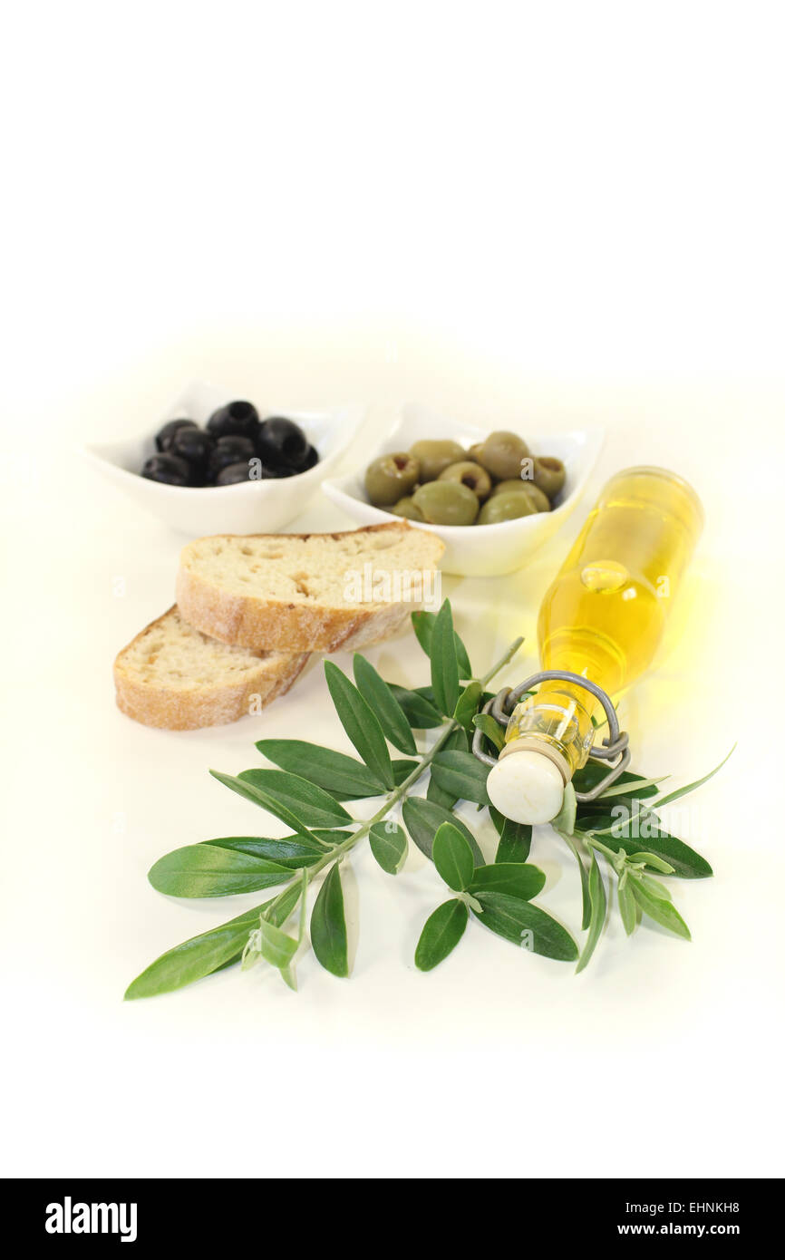 bottle of olive oil with olives and branch Stock Photo - Alamy