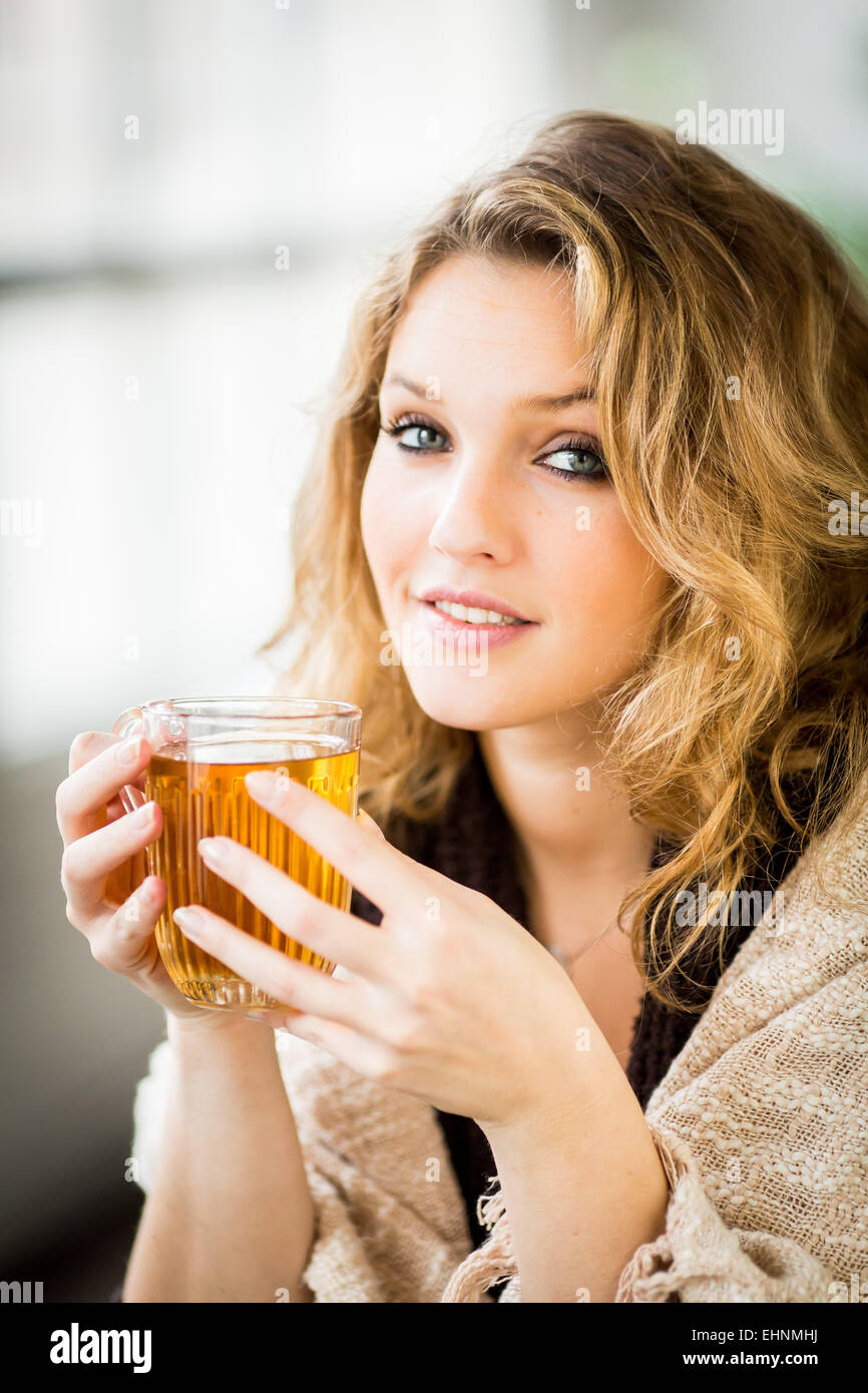 Woman drinking hot beverage Stock Photo Alamy