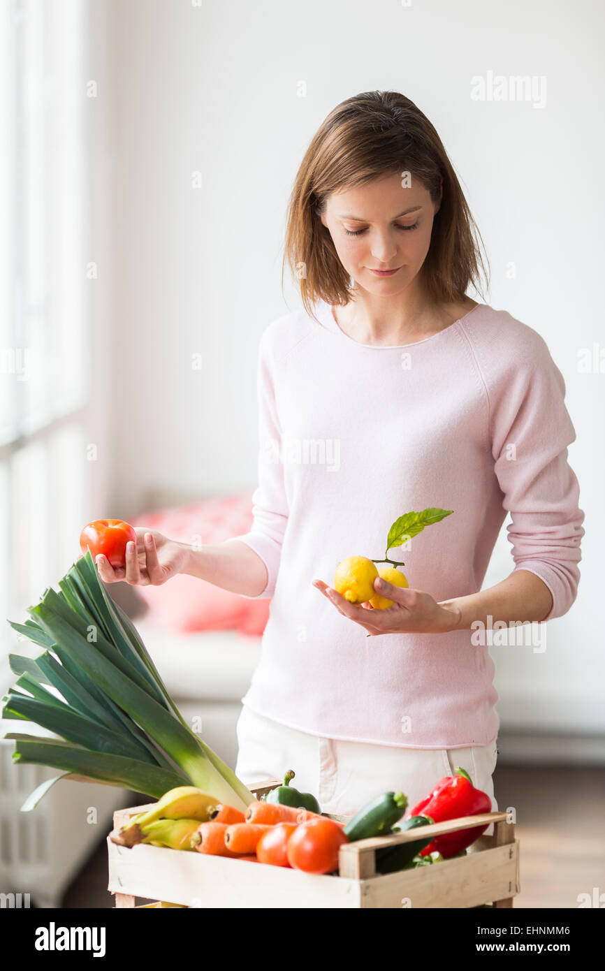Woman with vegetables basket Stock Photo - Alamy