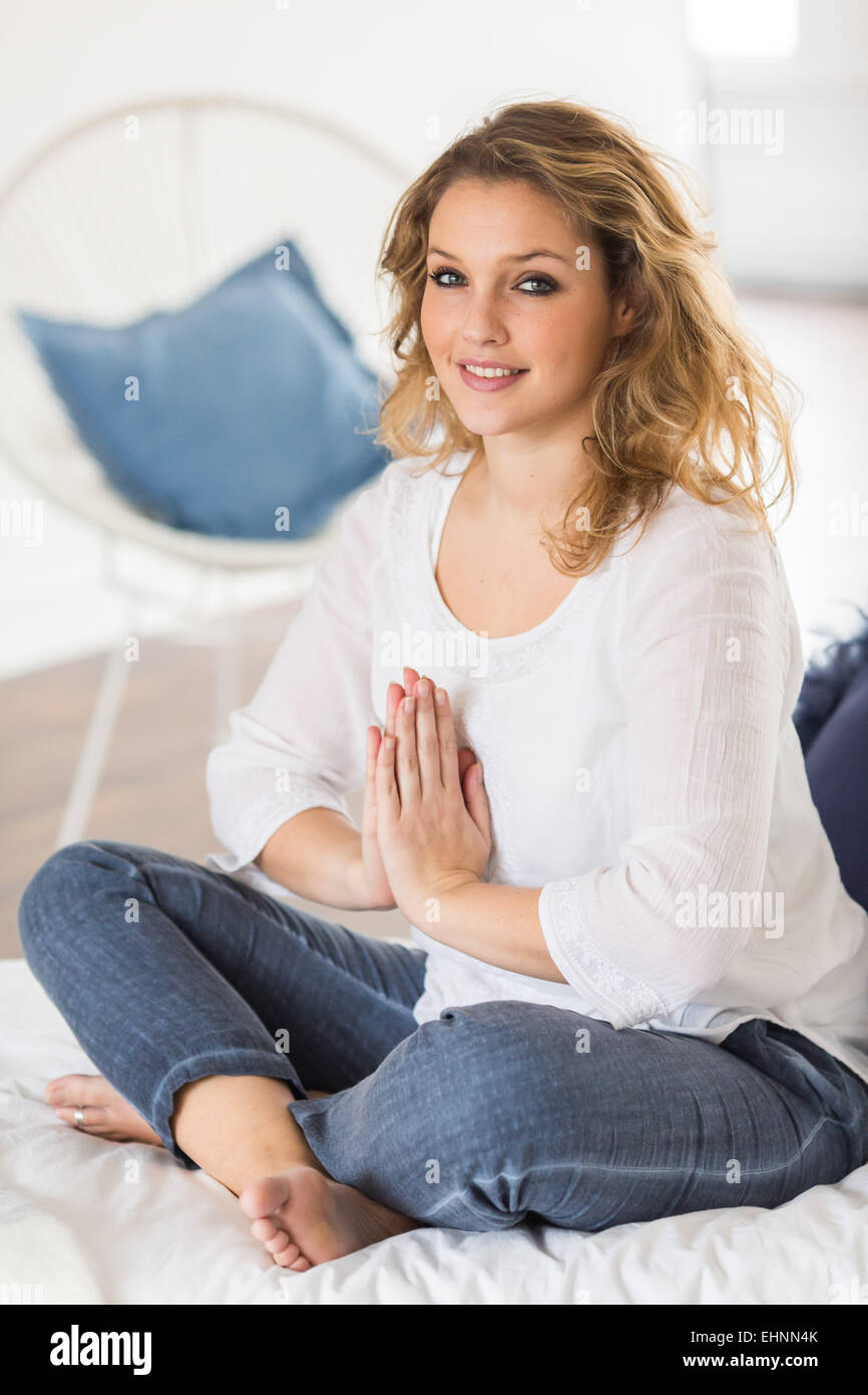 Woman doing breathing exercises. Stock Photo