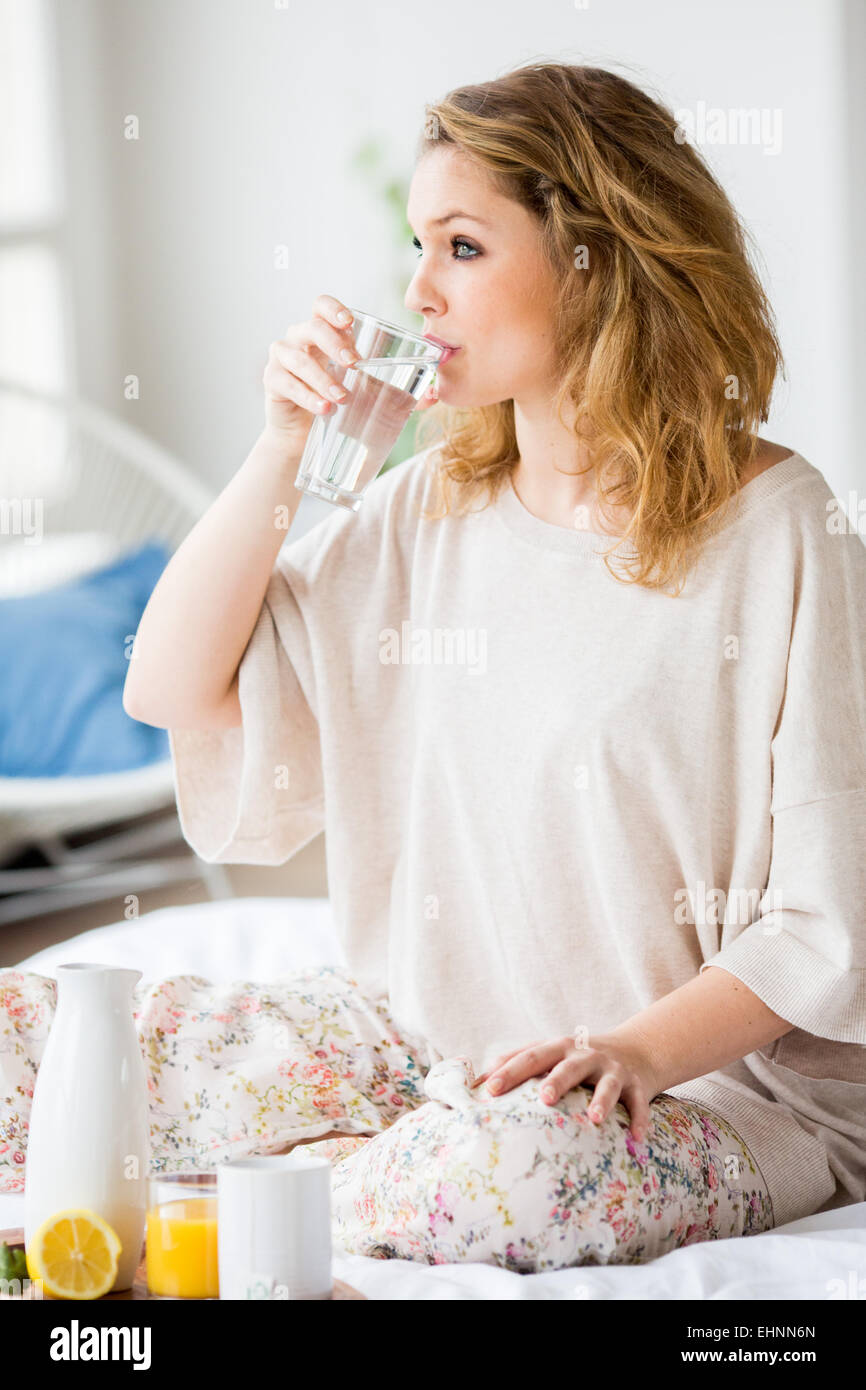 Woman drinking glass of water. Stock Photo