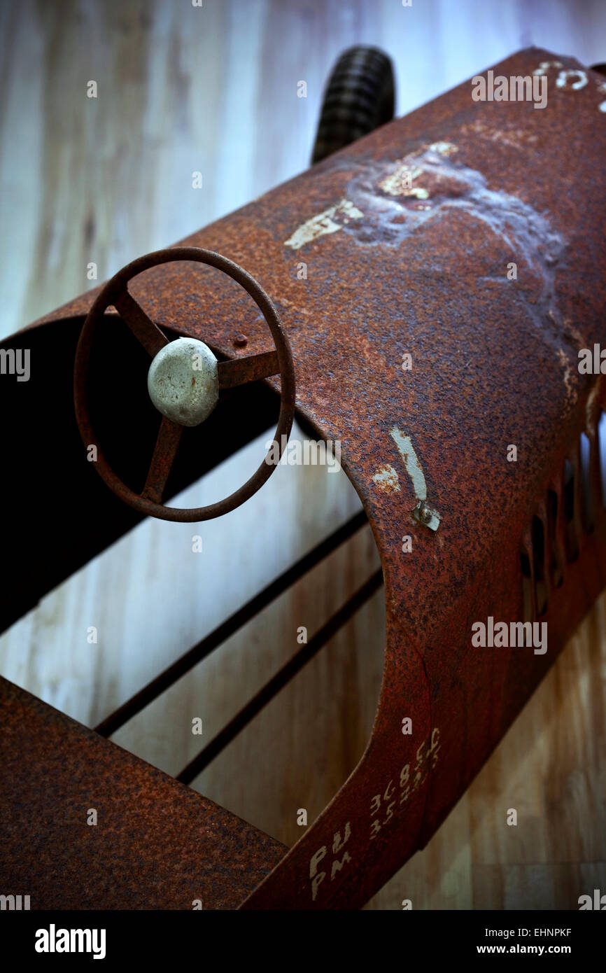 Close up of an old toy car in a garage Stock Photo