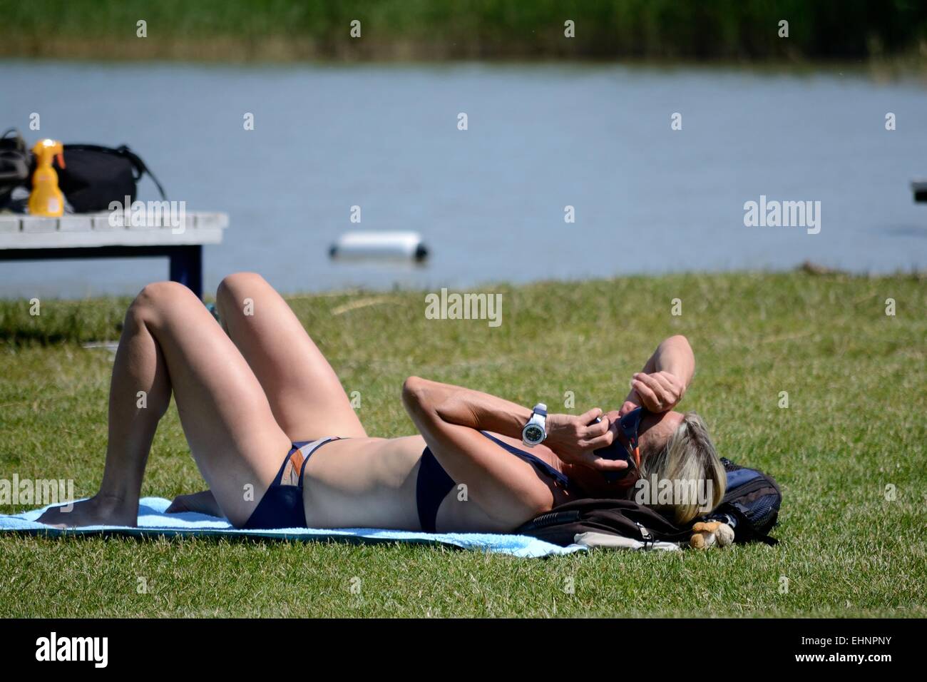 Woman in bikini sunbathes Stock Photo