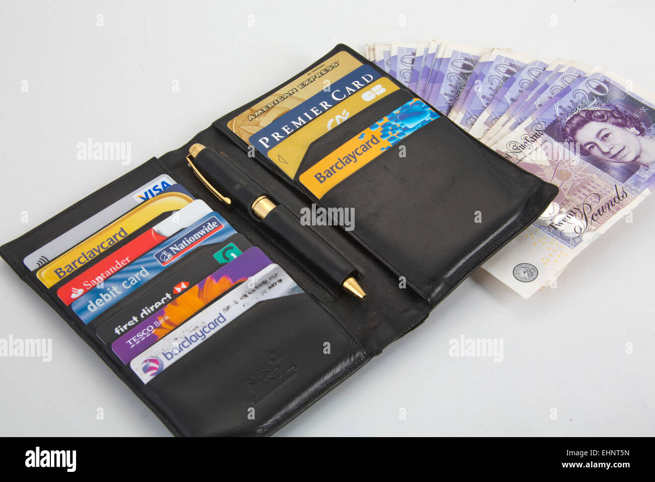 Black wallet with Assortment of credit cards Visa and American express 151141 Credit Cards Stock Photo