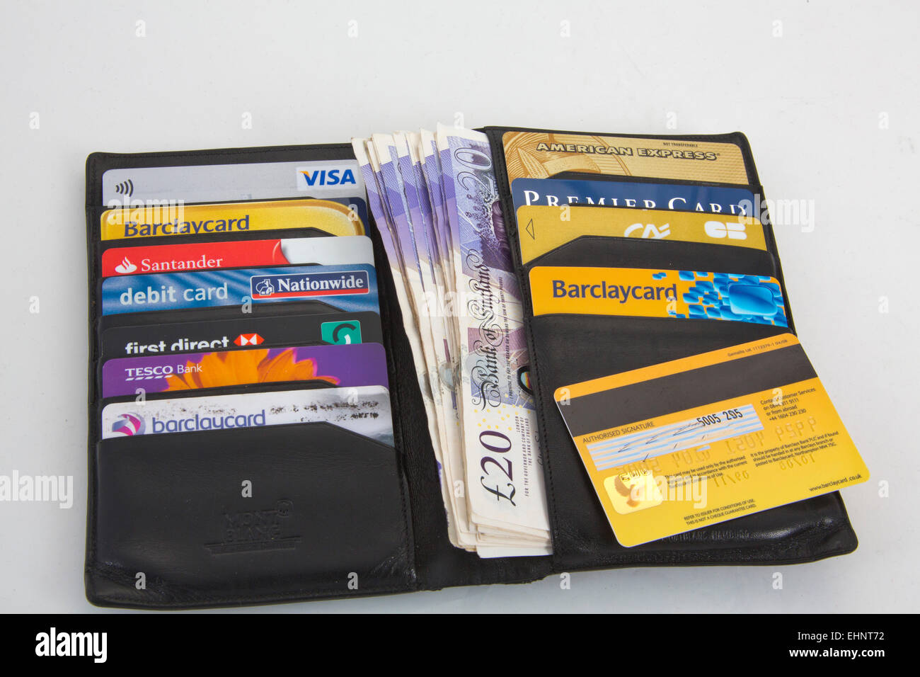 Black wallet with Assortment of credit cards Visa and American express 151143 Credit Cards Stock Photo