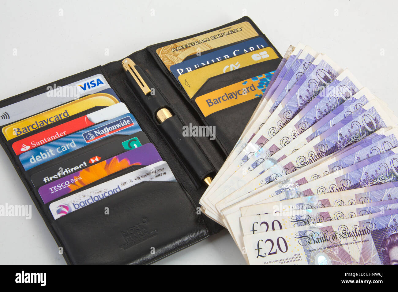 Black wallet with Assortment of credit cards Visa and American express 151146 Credit Cards Stock Photo