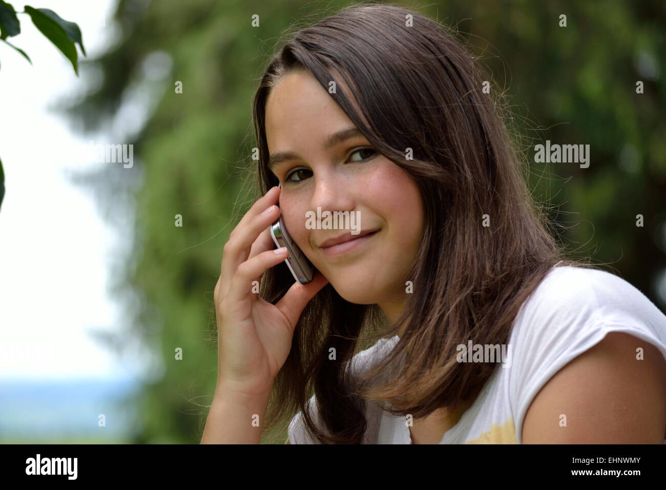 Portrait of a teenager phoning Stock Photo