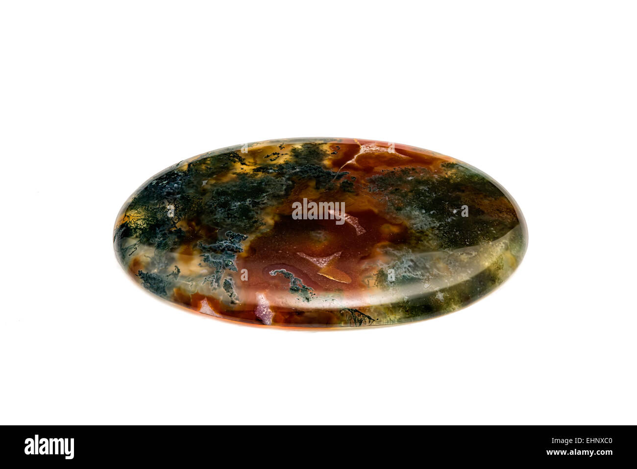 Moss Agate  (Chalcedony, the compact crystalline variety of quartz) Mocha Stone Cabochon with dark moss-like inclusions Crystal Stock Photo