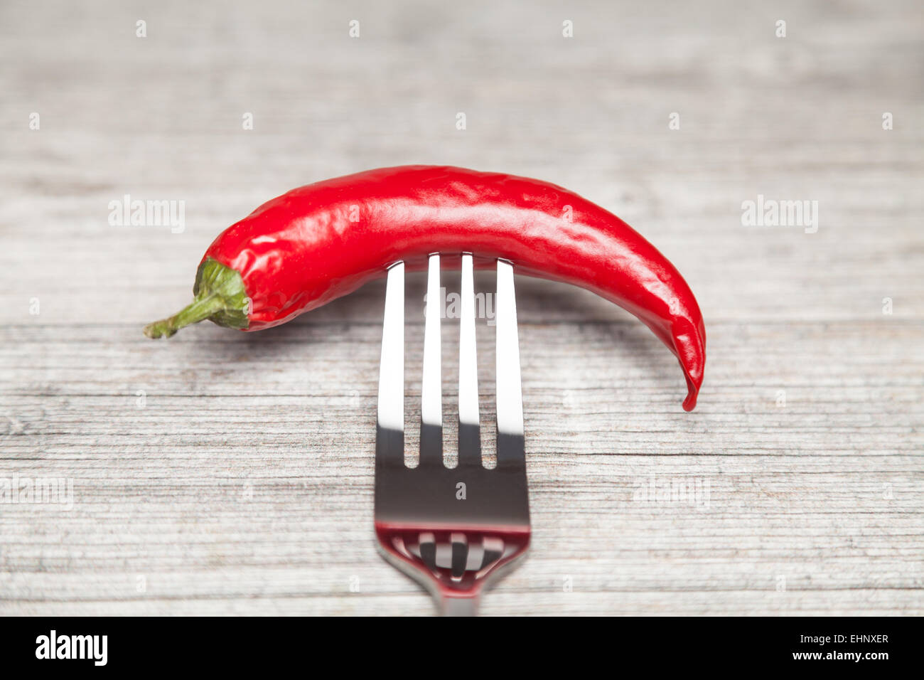 peperoni impaled with a fork Stock Photo