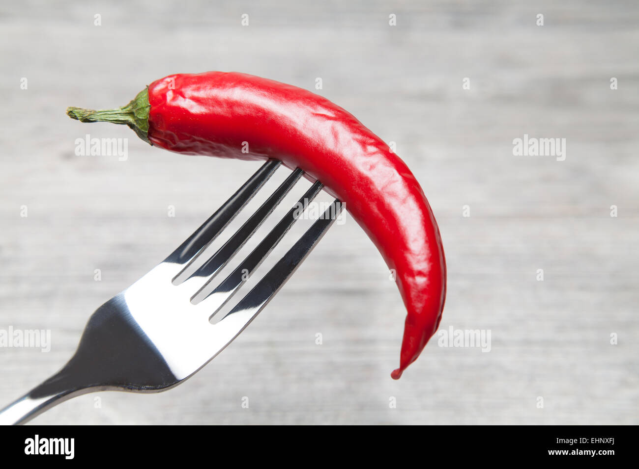 peperoni impaled with a fork Stock Photo