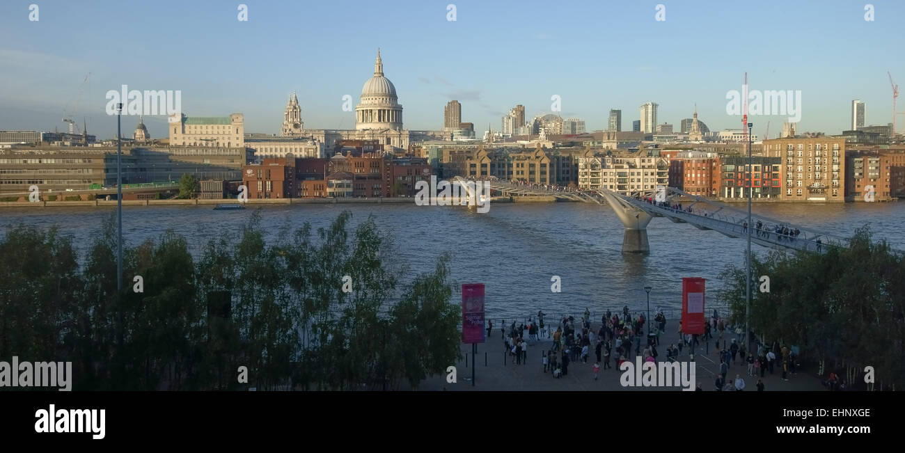 River Thames, the Millenium Bridge, St Paul's Cathedral and other buildings on the North Bank, fine evening in autumn, London Stock Photo