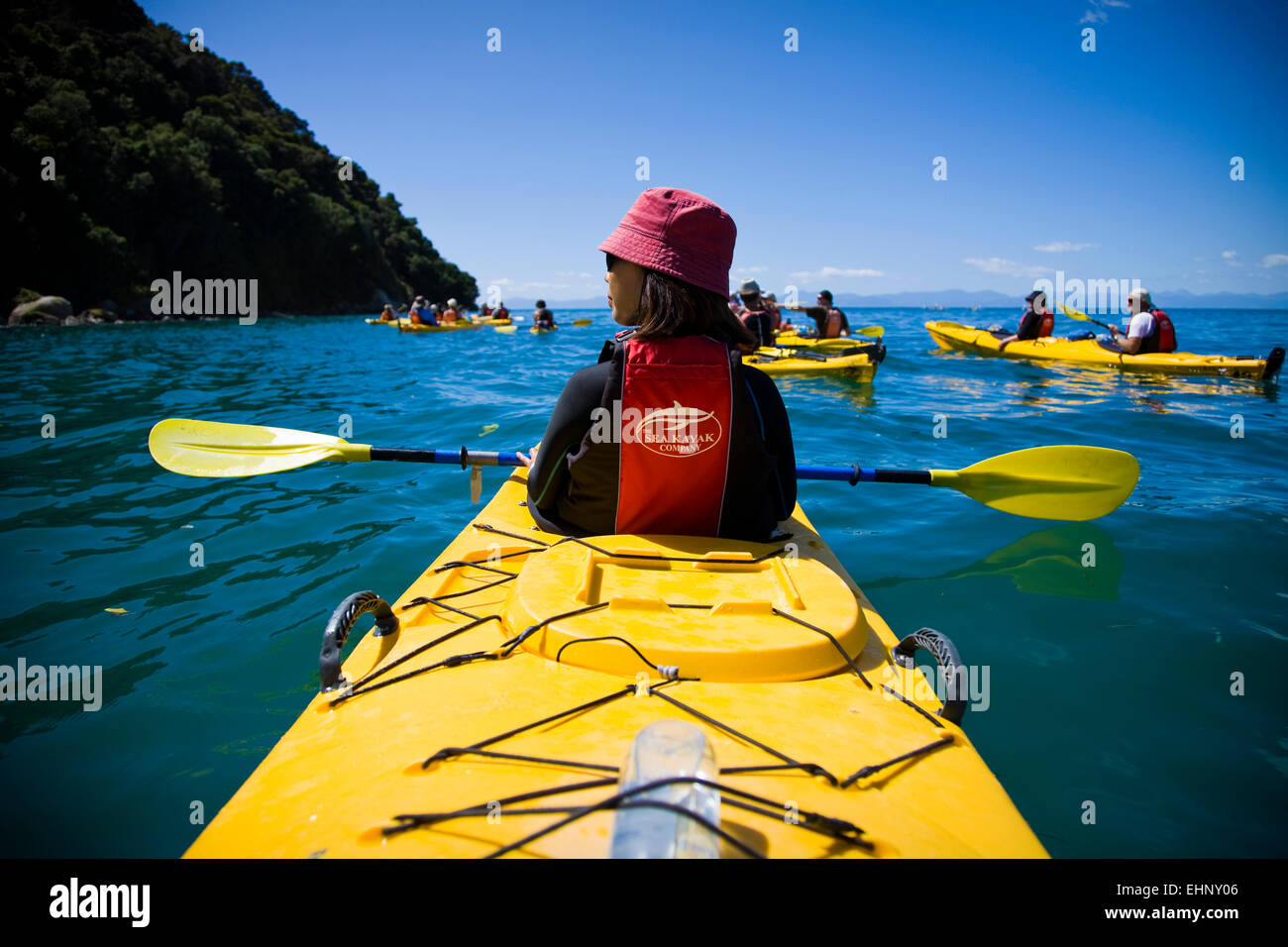 A woman kayaking on a day trip in Abel Tasman National Park, Tasman