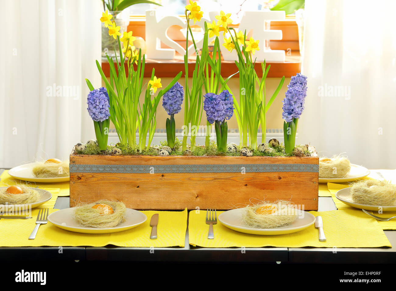 Easter table decorated with spring flowers Stock Photo - Alamy