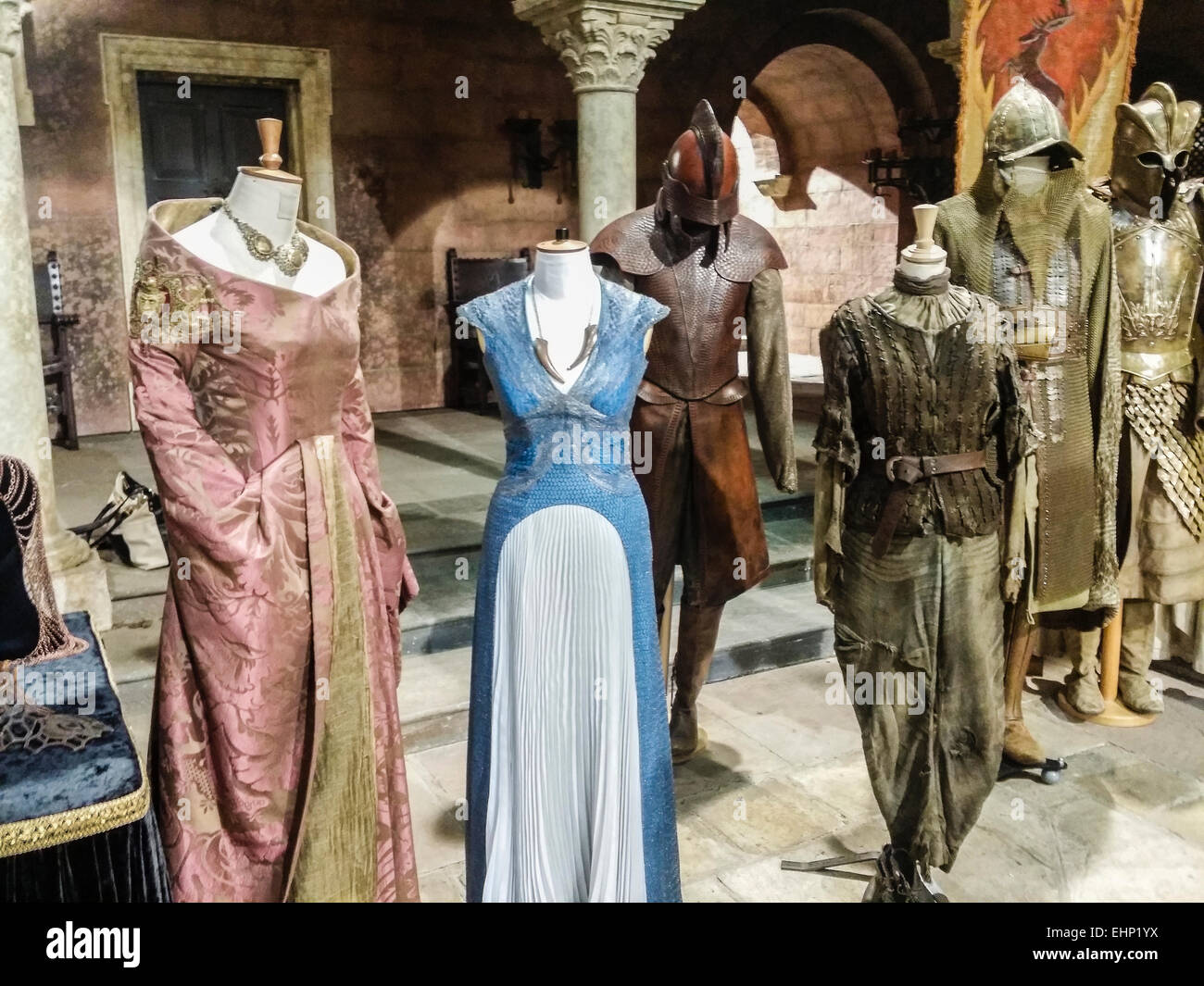 Costumes including Queen Cersei Lannister's and Daenerys Targaryon's dresses, Arya Stark's boyish costume and Jamie Lannister's armour, in the prop room of Game of Thrones, Belfast Stock Photo