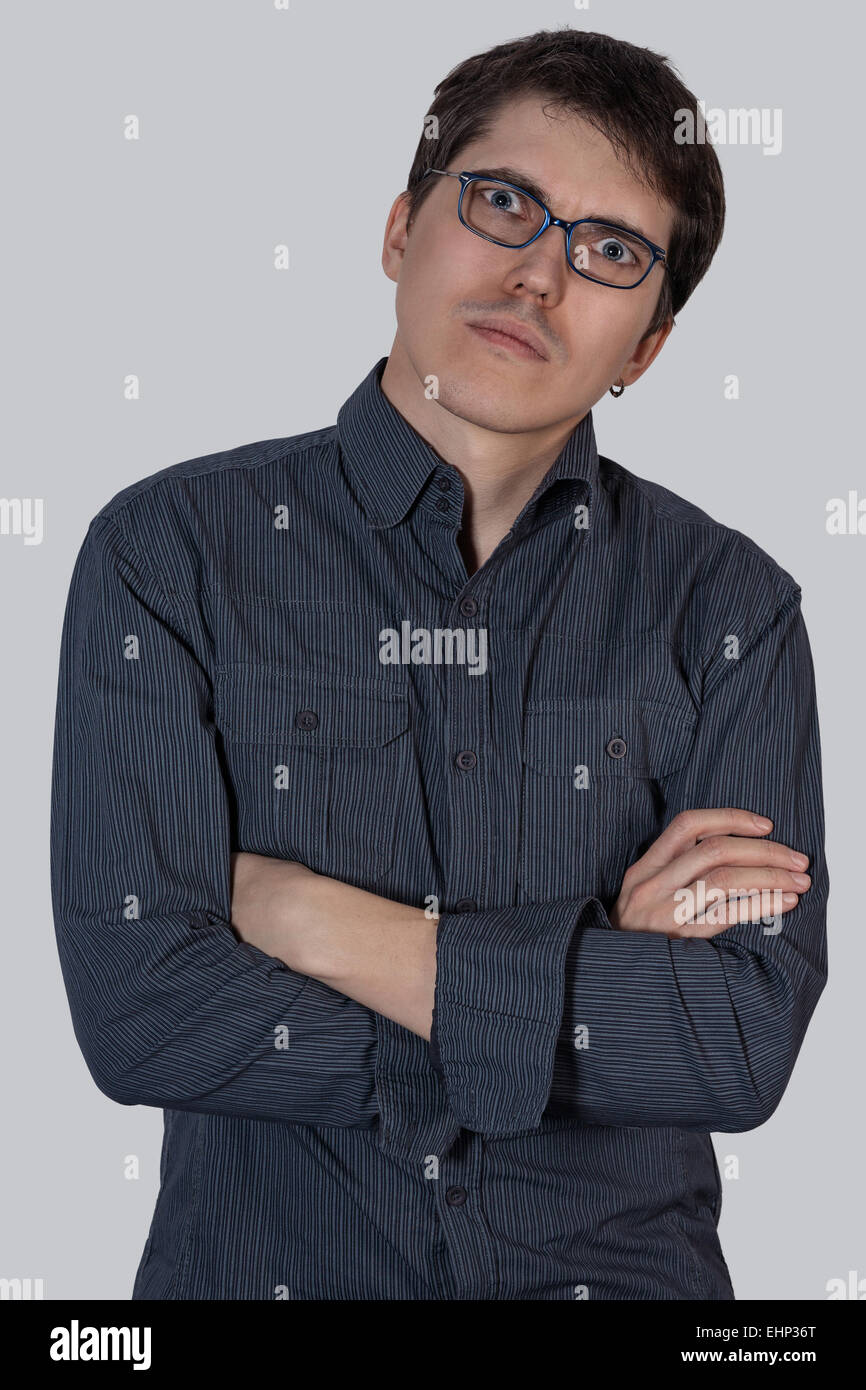 Portrait of a young man in the blue shirt and glasses Stock Photo - Alamy