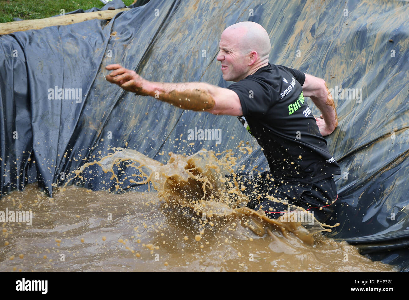 A competitor taking part in The Battle of Lansdown Obstacle Race. Stock Photo