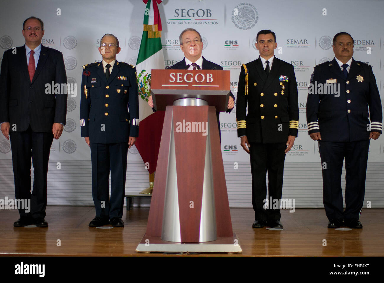 Mexico City, Mexico. 16th Mar, 2015. The National Security Comissioner, Monte Alejandro Rubido(C), takes part in a press conference about the detention of Daniel Menera Sierra and Octavio Gomez Gomez, alleged operators of the criminal organization 'Los Zetas', in the headquarters of the Secretariat of Interior (SEGOB, for its acronym in Spanish), in Mexico City, capital of Mexico, on March 16, 2015. Credit:  Pedro Mera/Xinhua/Alamy Live News Stock Photo