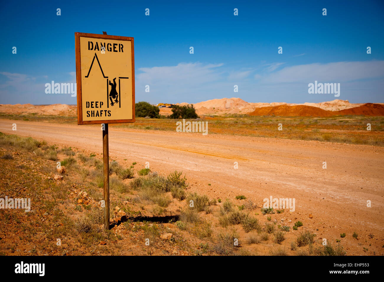 A road sign warning of deep mineshafts in opal mining country, Coober Pedy, Australia Stock Photo