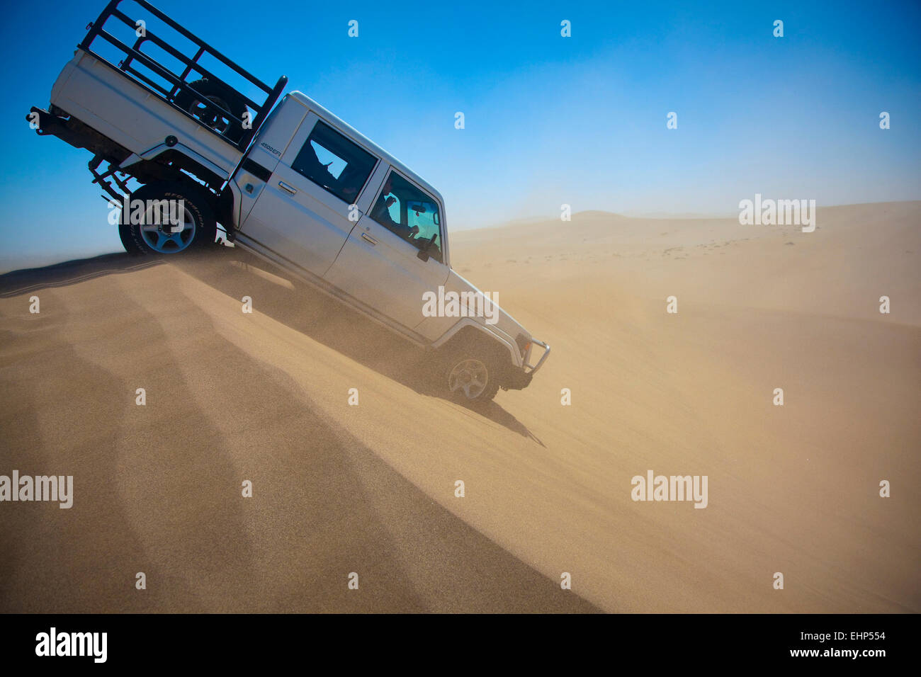 Dune bashing on a windy day in the Namib Desert, Namibia Stock Photo