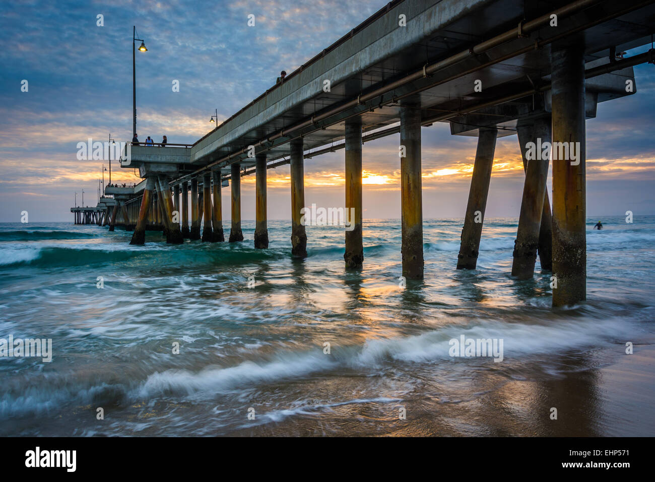 Waves in the Pacific Ocean and the pier at sunset, in Venice Beach, Los ...
