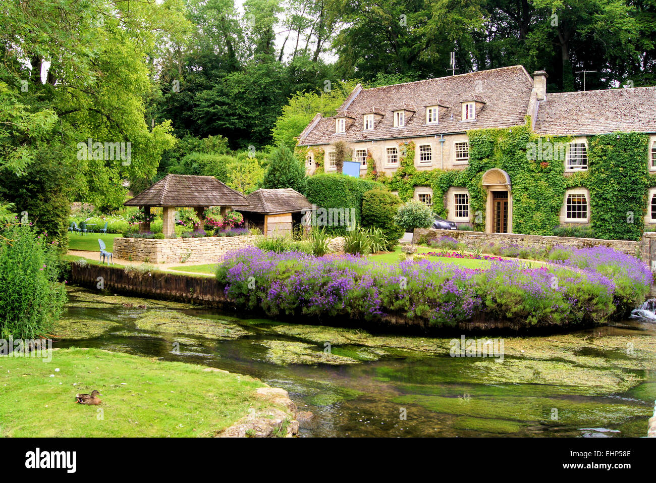 Picturesque garden in the Cotswold village of Bibury, England Stock Photo