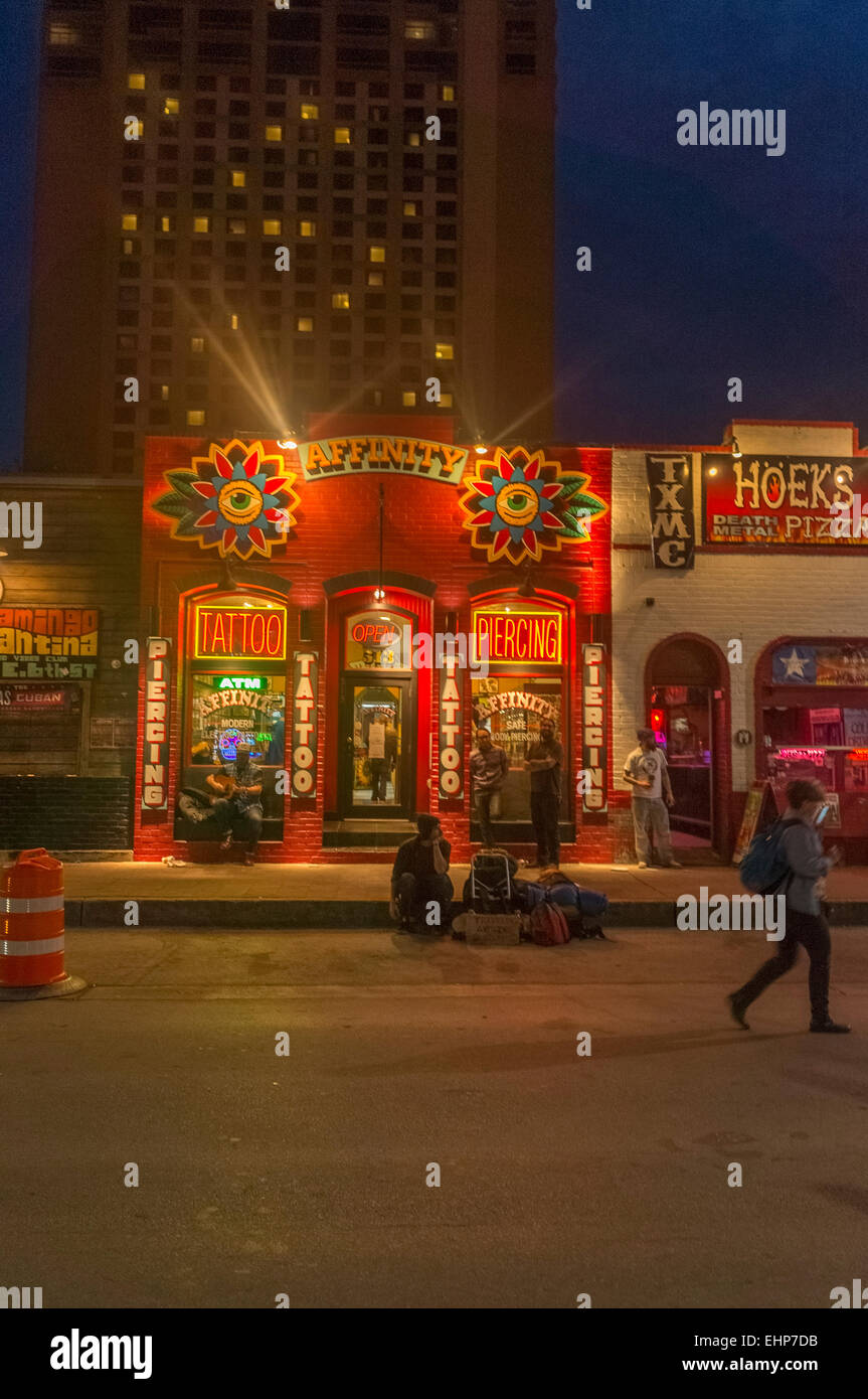Austin, Texas. 15th Mar, 2015. One of the many tattoo shops on 6th street in Austin Texas USA benefitting from the 2015 SXSW crowd. Credit: Jon-Paul Jones/Alamy Live News Stock Photo -
