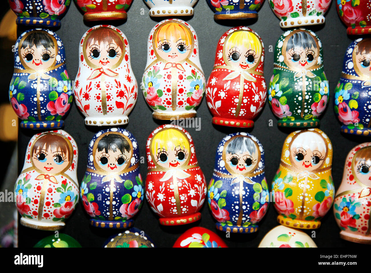 Colorful russian wooden dolls at a market . Matrioshka Babushkas dolls are the most popular souvenirs from Russia Stock Photo