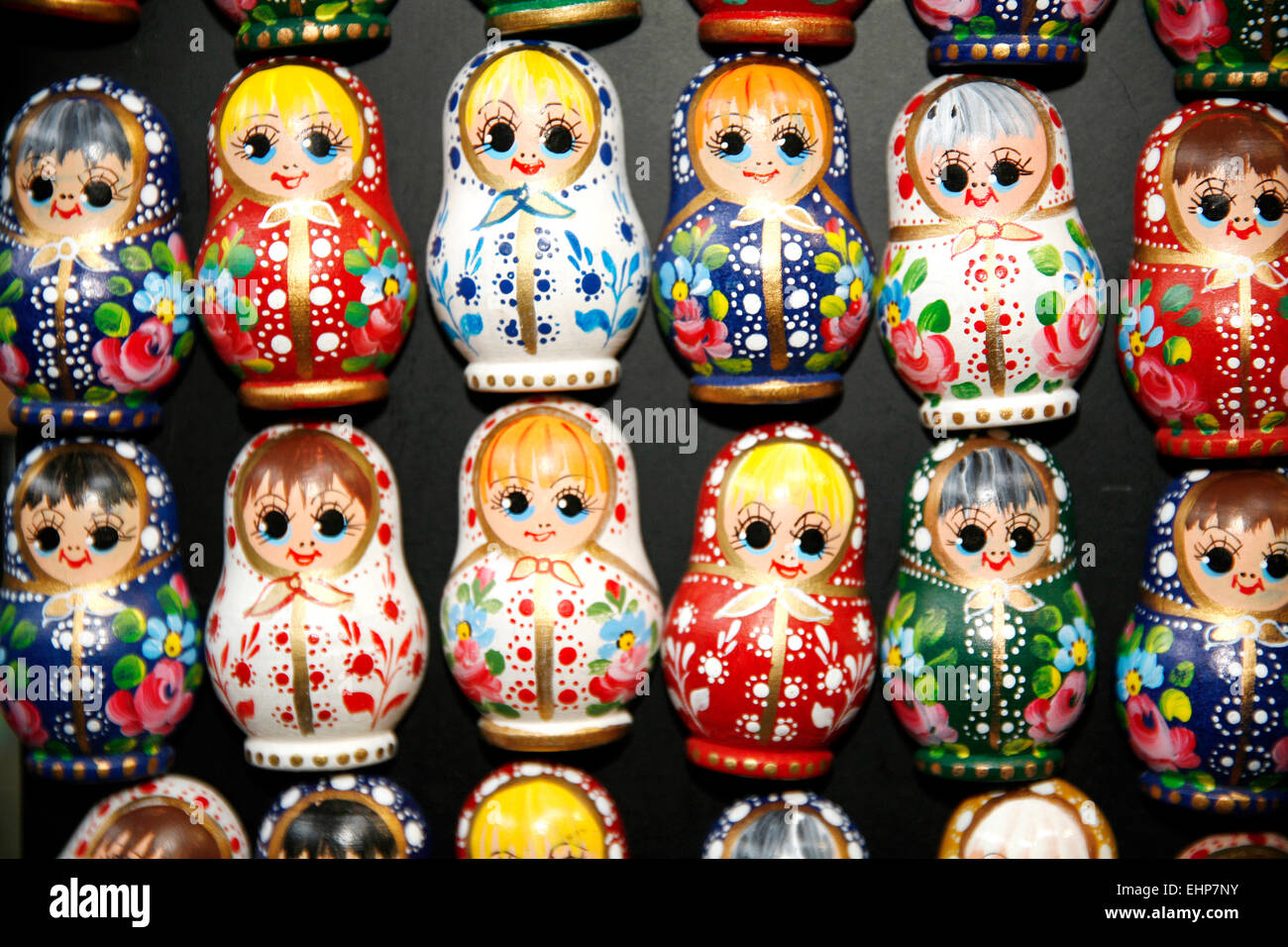 Colorful russian wooden dolls at a market . Matrioshka Babushkas dolls are the most popular souvenirs from Russia Stock Photo
