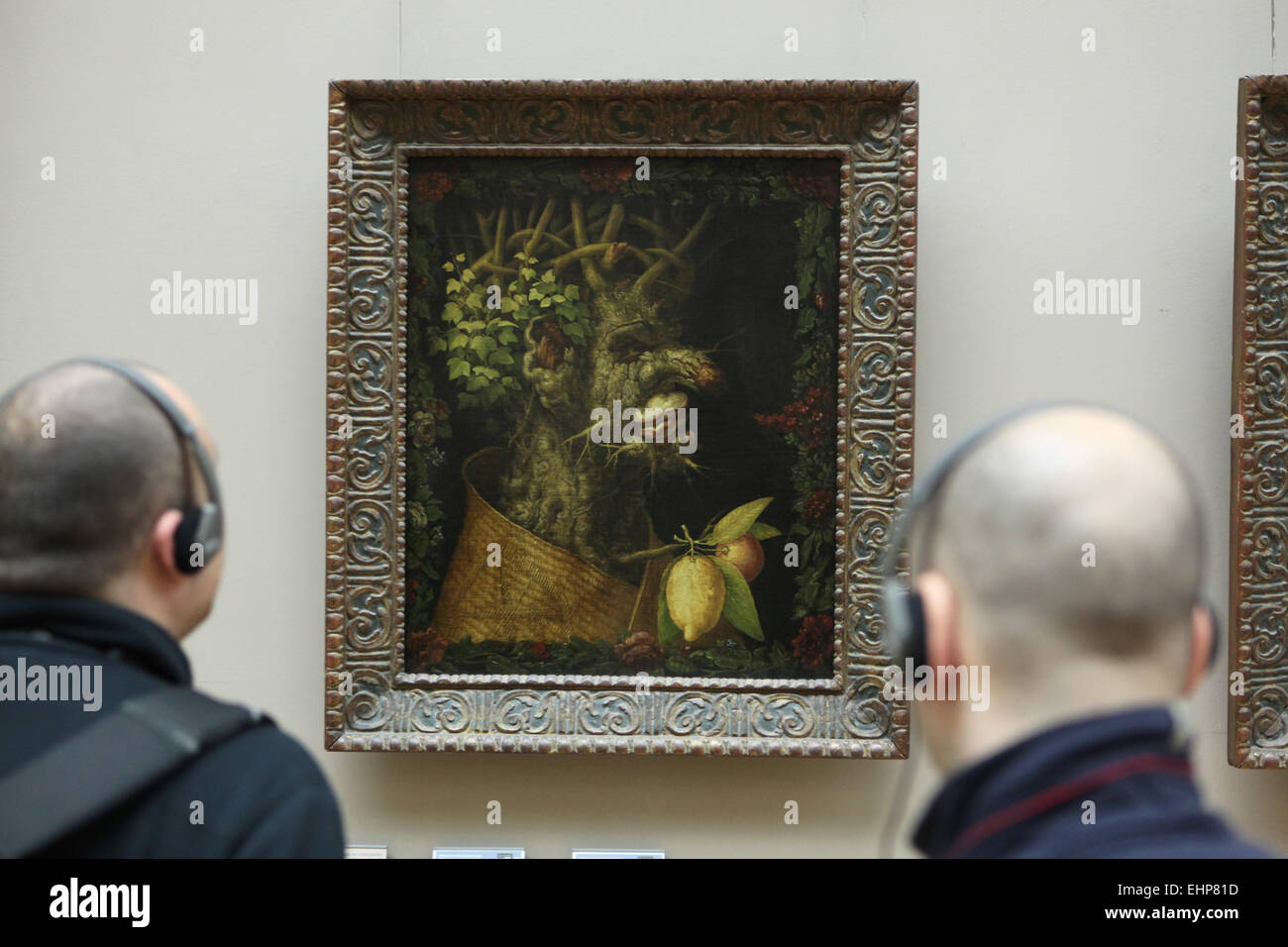 Visitors in front of the painting 'Winter' (1573) by Italian painter Giuseppe Arcimboldo. Louvre Museum, Paris, France. Stock Photo